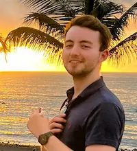 Profile shot of Jake Ord with a sunset in the background